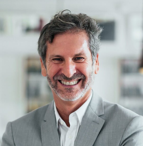 Man in Gray Suit Working as an Executive Client with Valiant Career